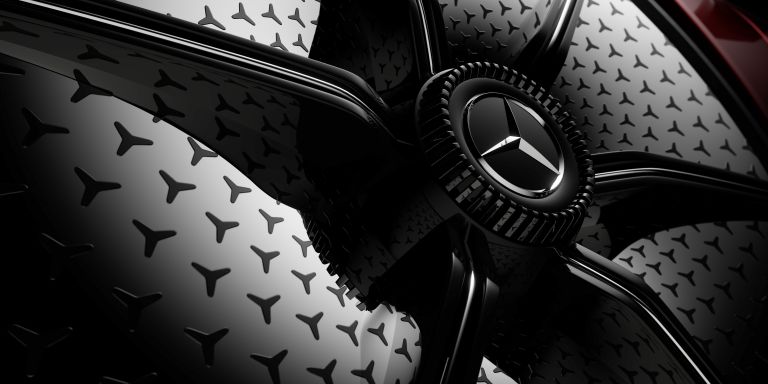 Close-up of the Mercedes Emblem on a Black Car · Free Stock Photo